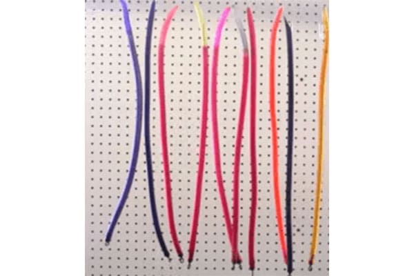 A pegboard with ten colorful shoelaces hanging vertically. The shoelaces are in various colors, including blue, pink, yellow, red, and orange.